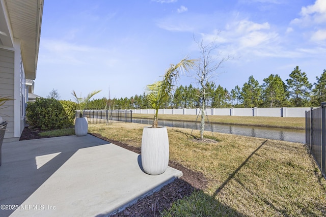 view of yard with a trampoline and a patio area