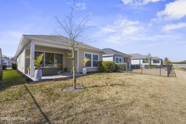 back of property featuring an outdoor hangout area, a patio area, and a lawn