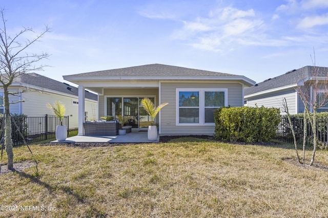 rear view of house with an outdoor living space, a yard, and a patio