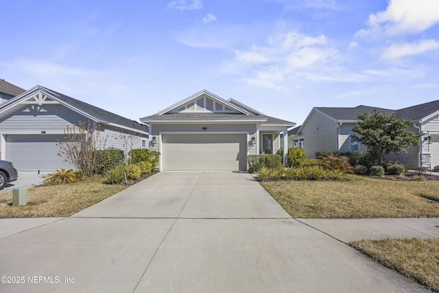 view of front of home with a garage and a front lawn