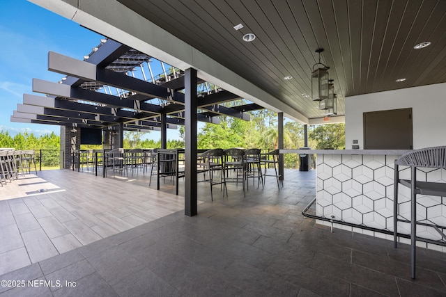 view of patio / terrace featuring an outdoor bar