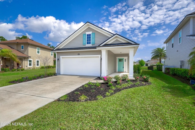 view of front of home with a front yard, concrete driveway, and a garage