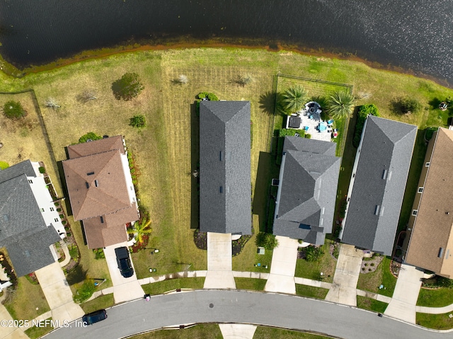 birds eye view of property with a residential view