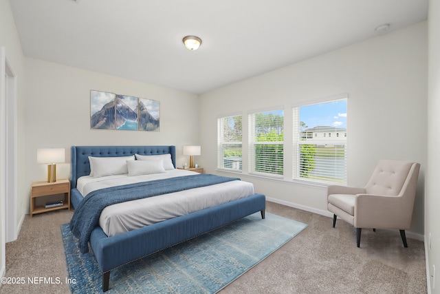 bedroom with carpet and baseboards