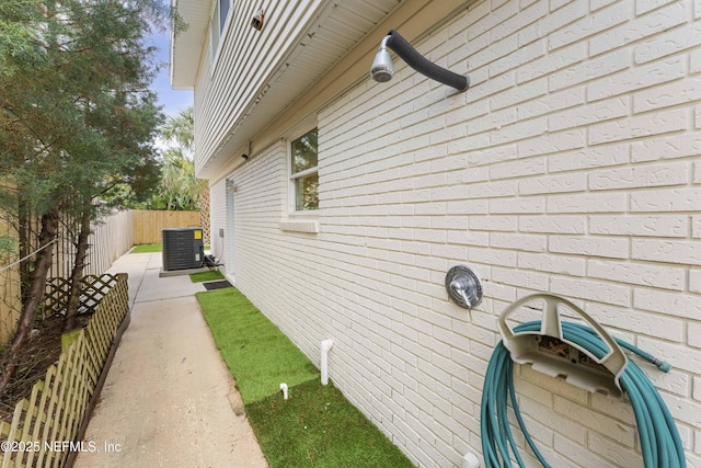 view of side of home featuring central AC and a patio