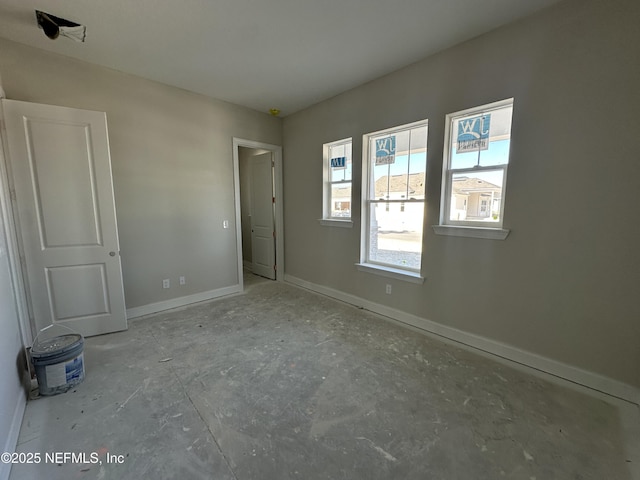 unfurnished bedroom featuring baseboards