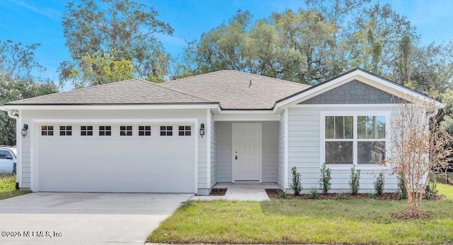 ranch-style house featuring a garage and a front yard