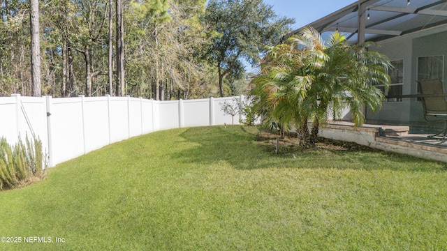 view of yard featuring glass enclosure