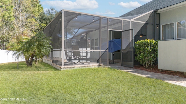 back of house with a yard, a lanai, and a patio