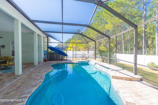 view of pool with a patio and a lanai