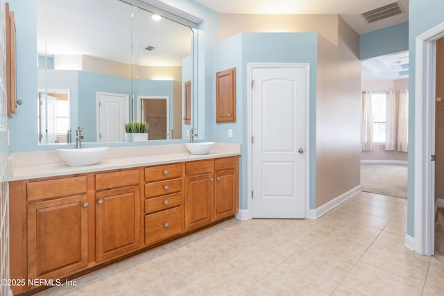 bathroom with vanity and tile patterned flooring