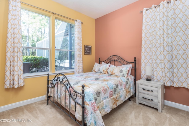 carpeted bedroom with multiple windows