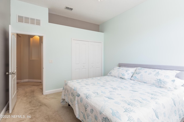 carpeted bedroom with a closet