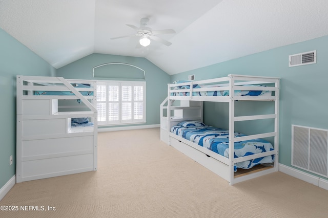 carpeted bedroom featuring lofted ceiling and ceiling fan