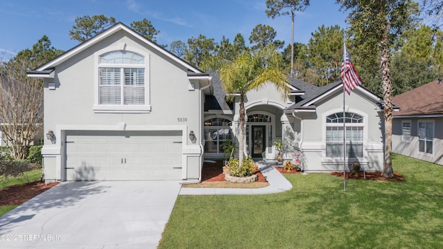 view of front of home with a garage and a front yard