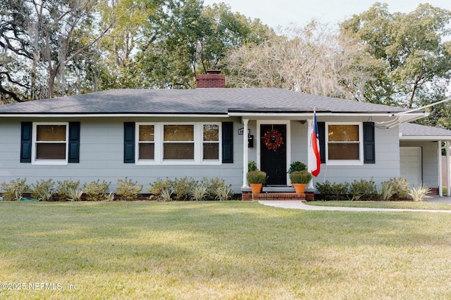 ranch-style home with a front lawn