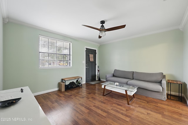 living room with dark hardwood / wood-style flooring, ornamental molding, and ceiling fan