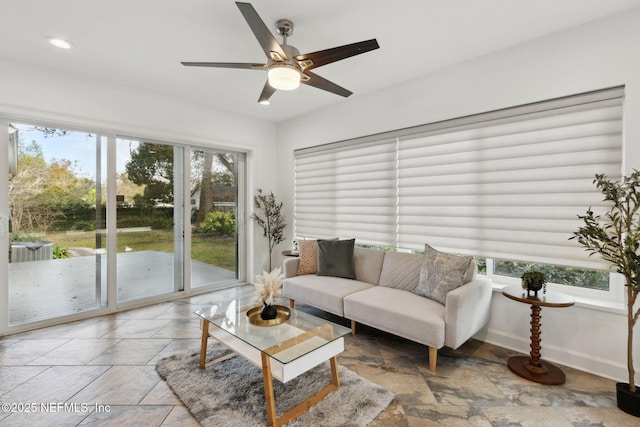 living room featuring ceiling fan