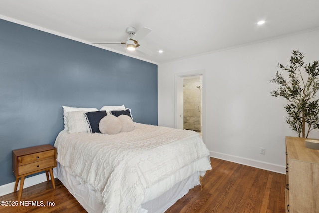 bedroom featuring dark wood-type flooring, ensuite bath, and ornamental molding