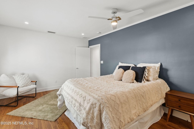 bedroom featuring hardwood / wood-style flooring and ceiling fan