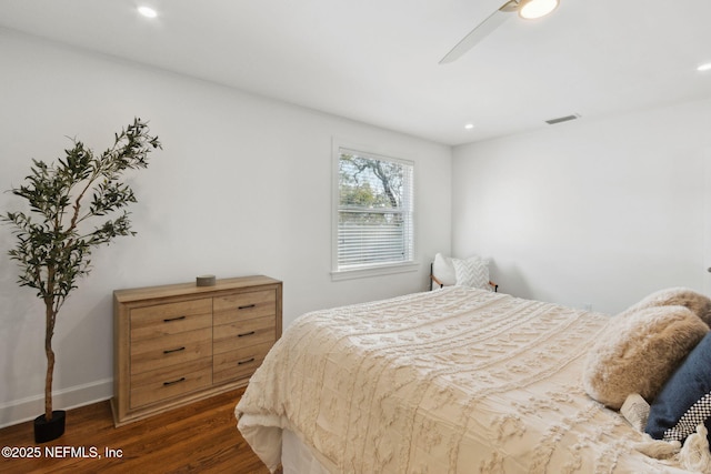 bedroom featuring dark wood-type flooring and ceiling fan