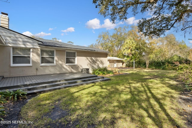 view of yard featuring a wooden deck