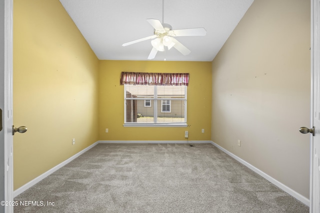 unfurnished room with ceiling fan, lofted ceiling, and light carpet