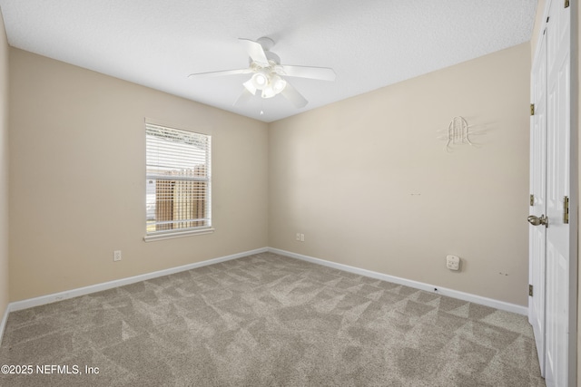 unfurnished room with light colored carpet, a textured ceiling, and ceiling fan