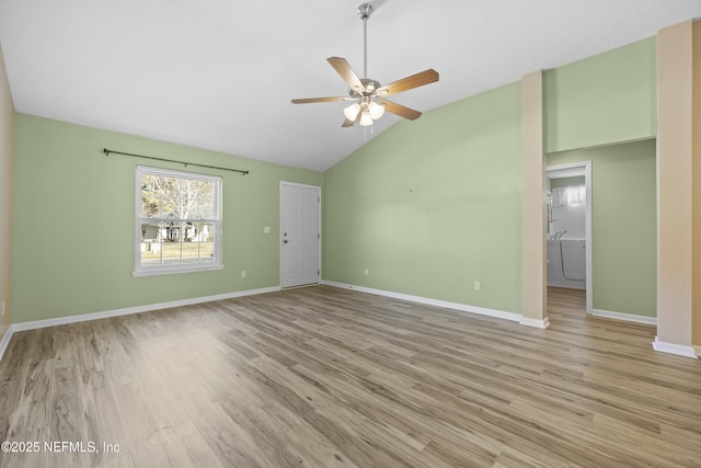 interior space with ceiling fan, lofted ceiling, and light hardwood / wood-style floors