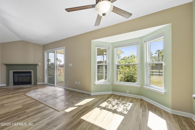 unfurnished living room with light hardwood / wood-style flooring and vaulted ceiling