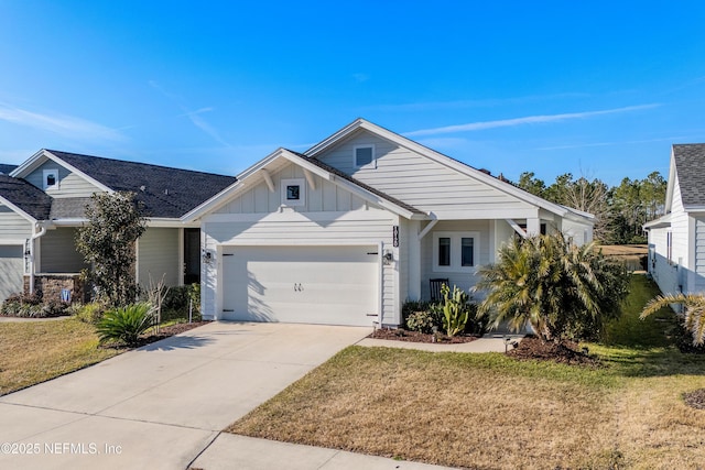 view of front of home featuring a garage and a front yard