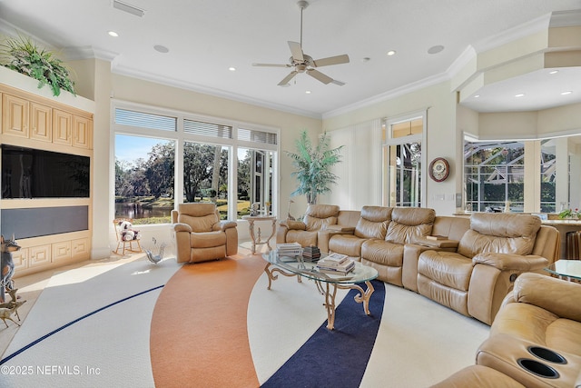 carpeted living room featuring crown molding and ceiling fan