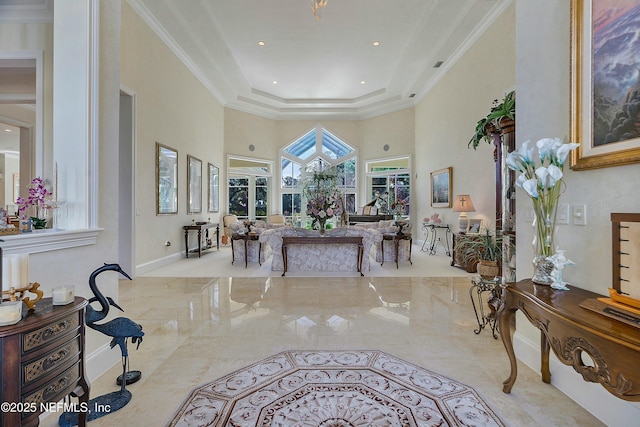 living room featuring a raised ceiling, crown molding, and a towering ceiling