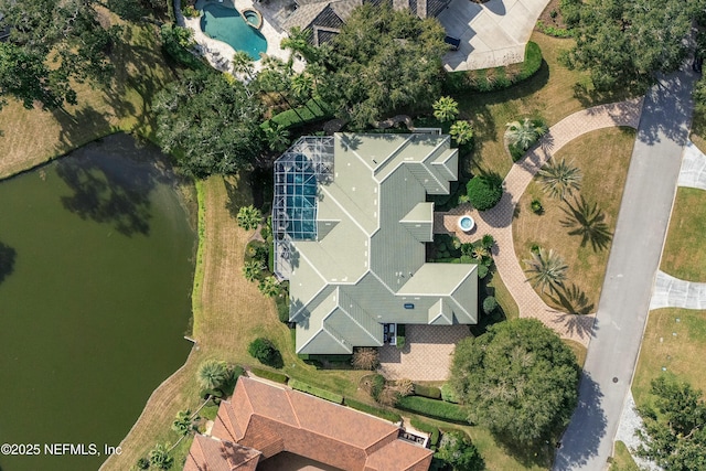 birds eye view of property with a water view