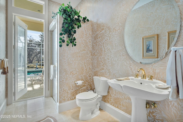 bathroom with tile patterned floors and toilet