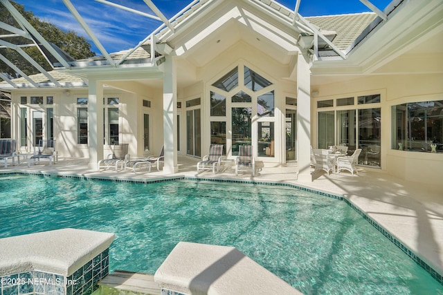 view of pool featuring a lanai and a patio