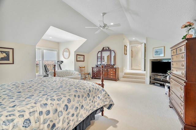 carpeted bedroom featuring lofted ceiling, ceiling fan, and a textured ceiling