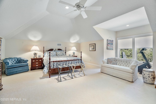 bedroom with ceiling fan, lofted ceiling, light carpet, and a textured ceiling