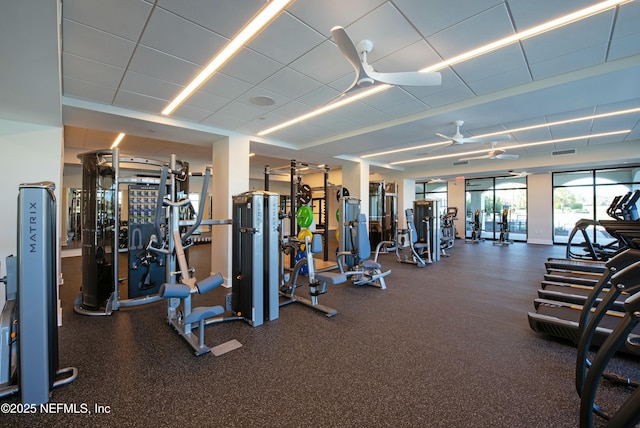 exercise room featuring visible vents and a ceiling fan