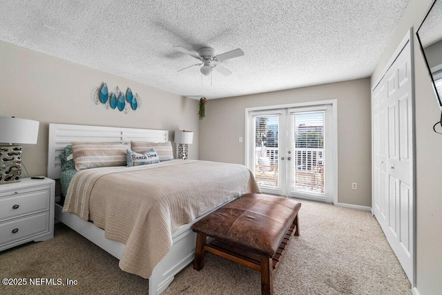 bedroom with ceiling fan, access to exterior, french doors, light colored carpet, and a closet