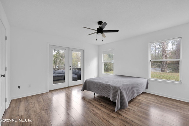 bedroom featuring hardwood / wood-style floors, access to exterior, ceiling fan, and french doors