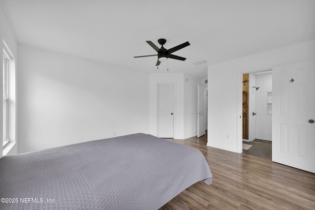 unfurnished bedroom with dark hardwood / wood-style floors and ceiling fan