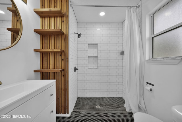 bathroom with a shower with curtain, vanity, and toilet