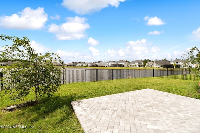 view of patio / terrace featuring a residential view and a fenced backyard