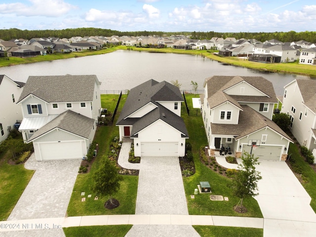 bird's eye view with a residential view and a water view