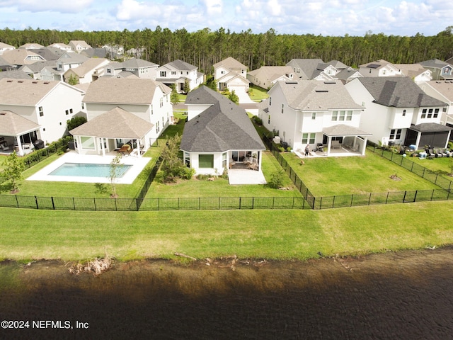 aerial view featuring a water view and a residential view