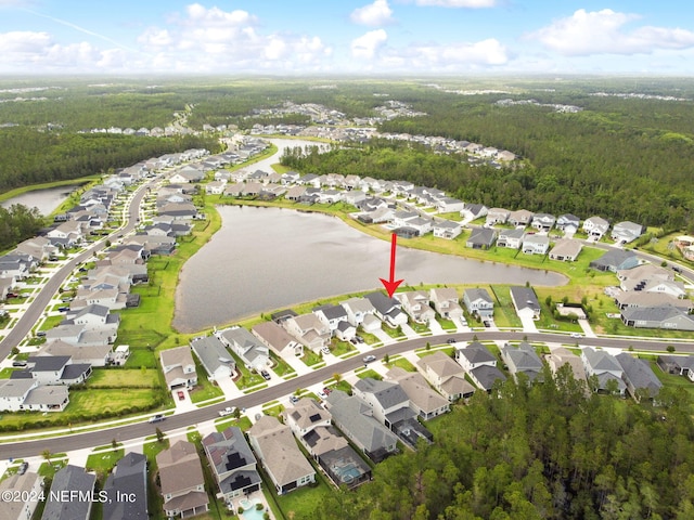 birds eye view of property featuring a residential view and a water view