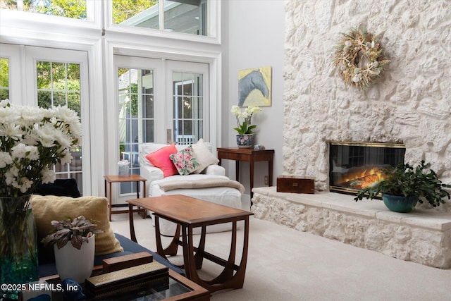 sunroom with a stone fireplace