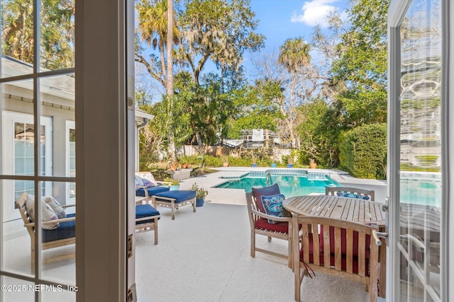 view of swimming pool with a patio area