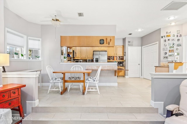 dining space with ceiling fan